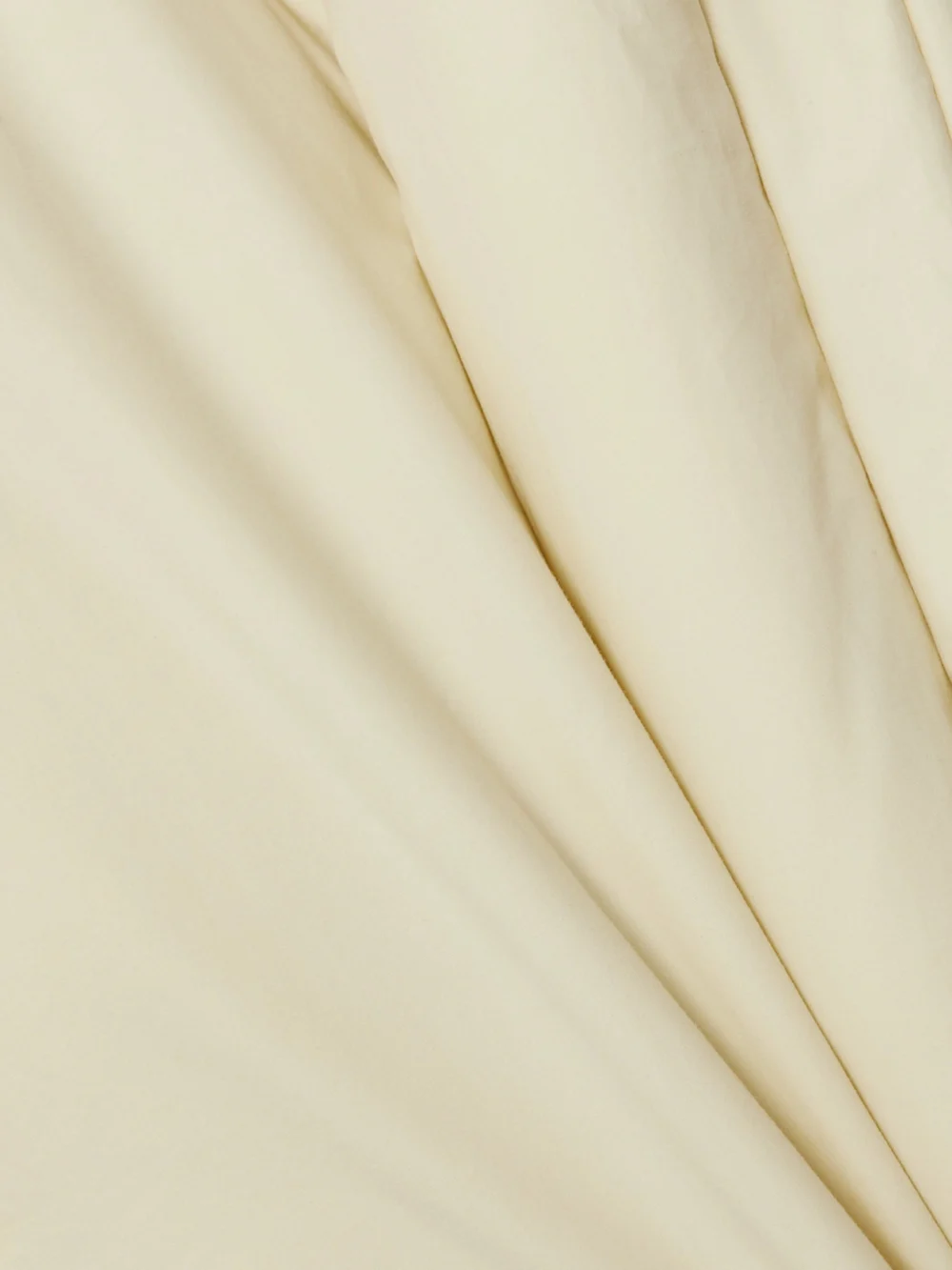 Close-up detail of the Givenchy Shearling and Leather-trimmed Quilted Cotton Down Coat