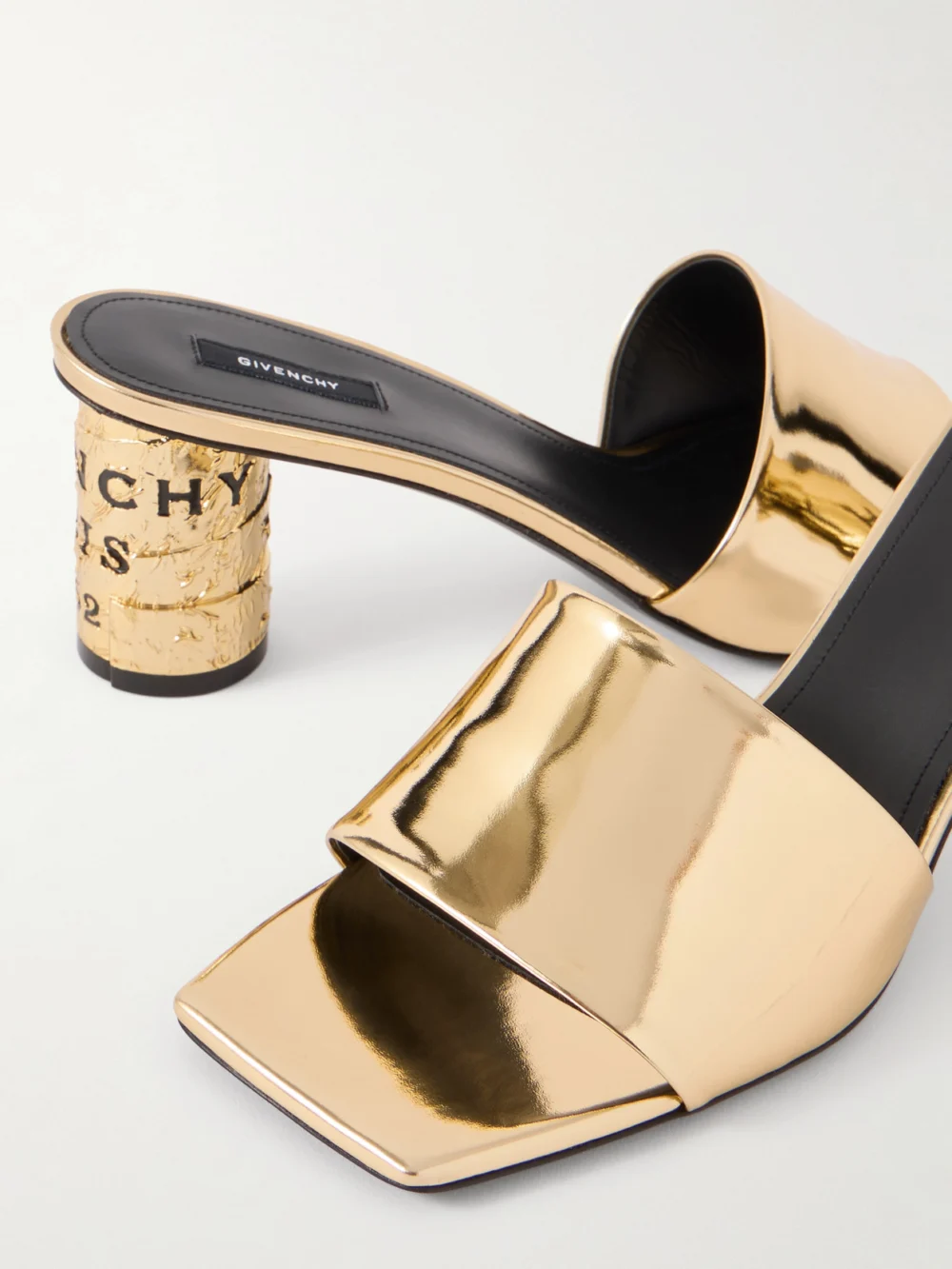 Close-up detail of the Givenchy Tape Metallic Leather Mules