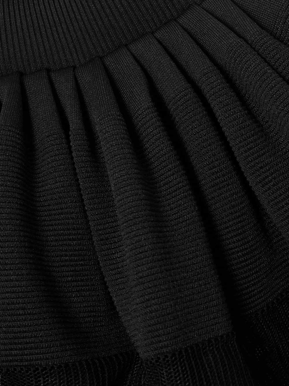 Close-up detail of the Givenchy Tiered Pleated Ribbed-knit Maxi Dress
