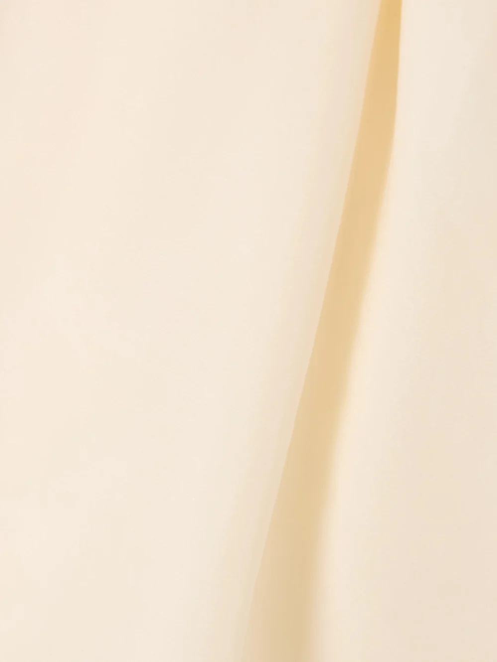 Close-up detail of the Givenchy Voyou Belted Satin-trimmed Silk Shirt