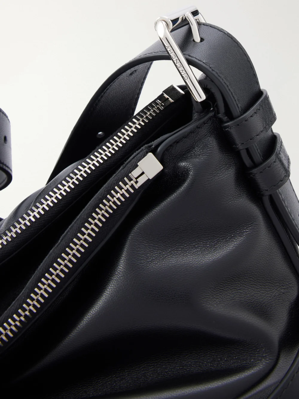 Close-up detail of the Givenchy Voyou Bomber Buckle-detailed Shoulder Bag