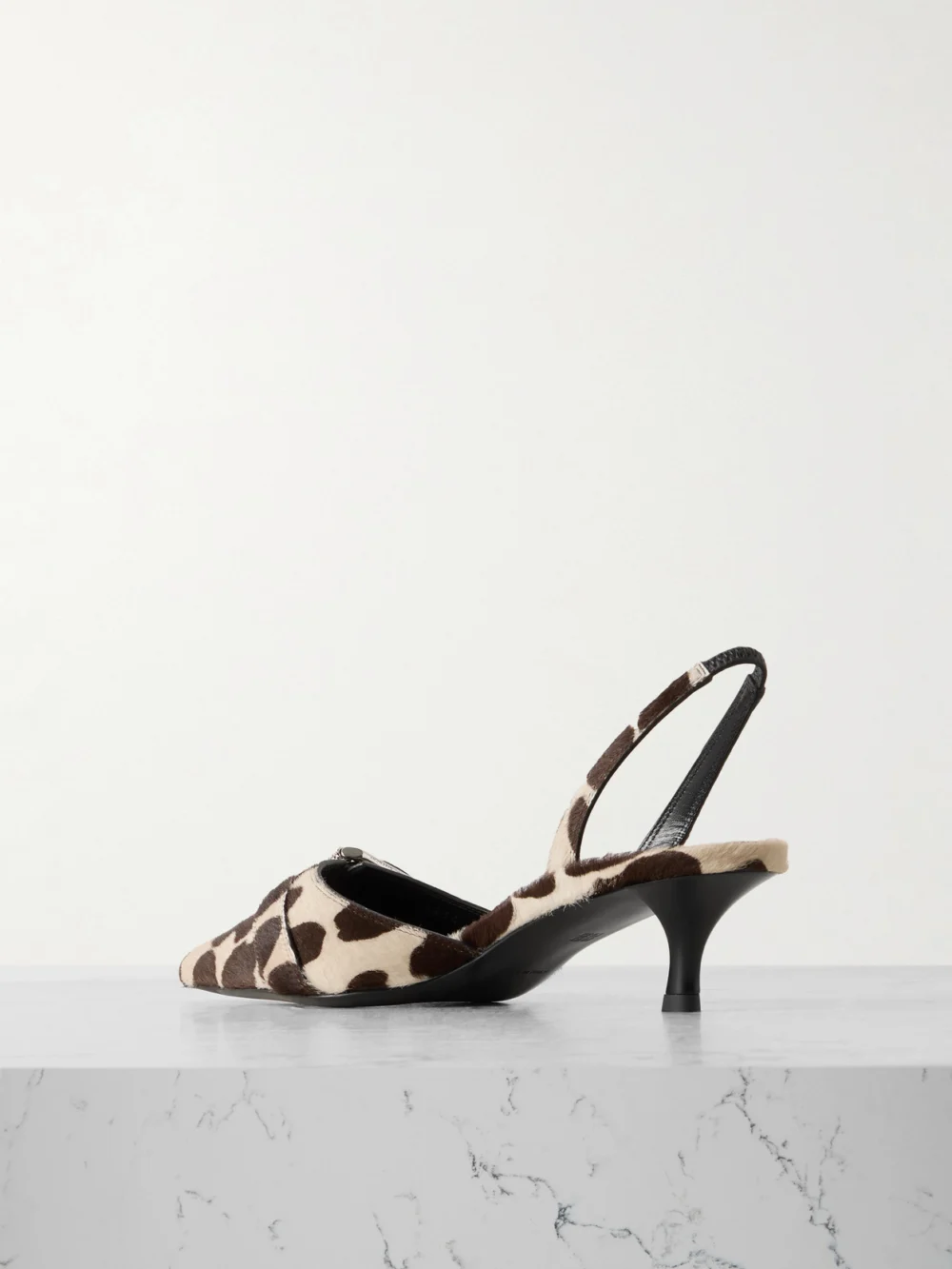 Back view of the Givenchy Voyou Buckled Printed Calf Hair Slingback Pumps