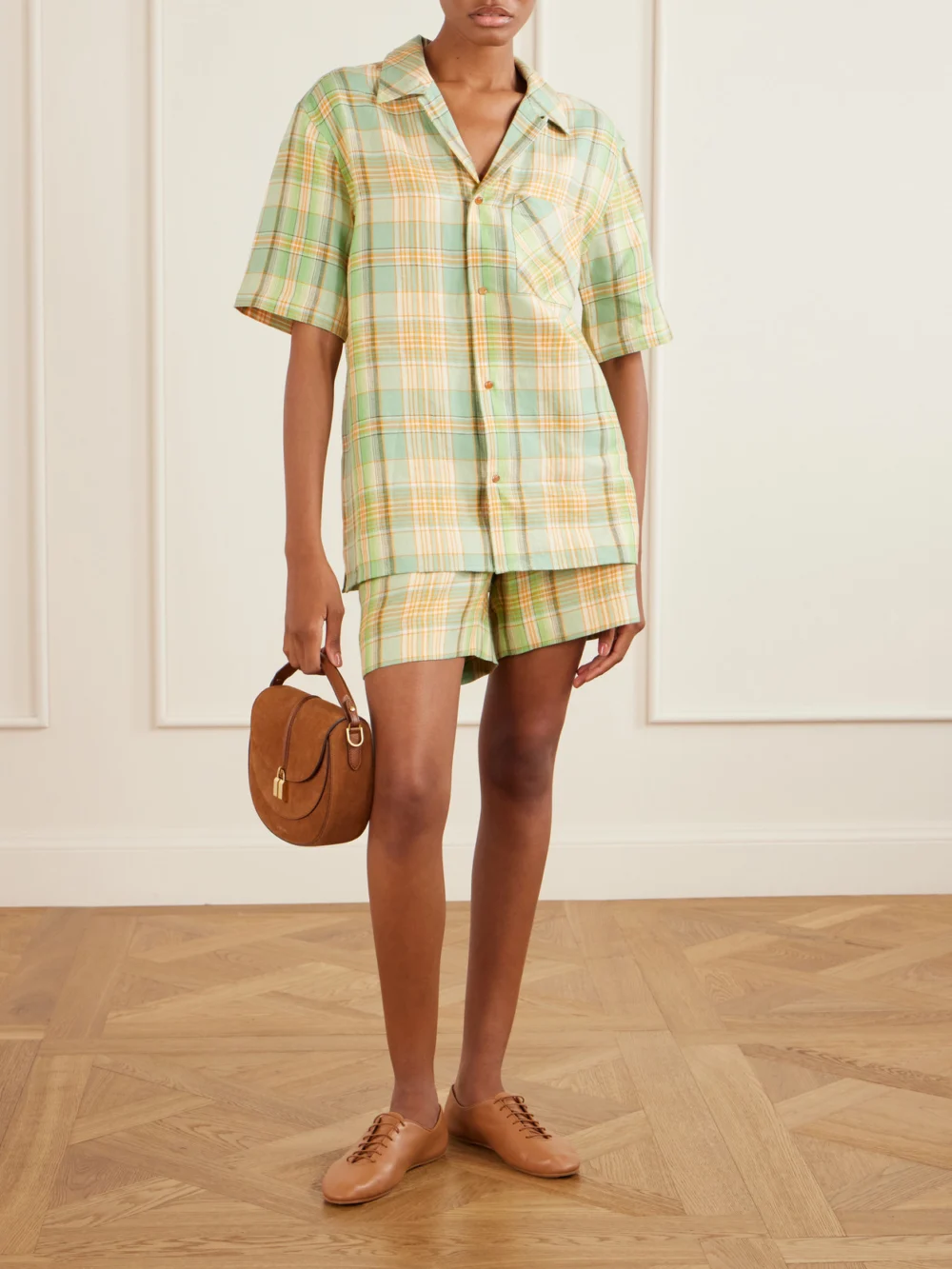 God’s True Cashmere Lime Moss Checked Linen Shorts, worn by a model