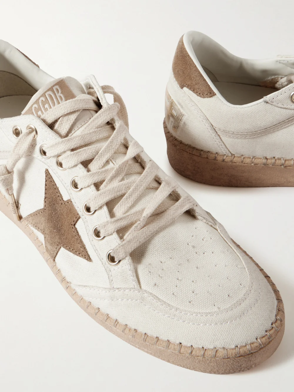 Close-up detail of the Golden Goose Ball Star Distressed Suede-trimmed Canvas Sneakers