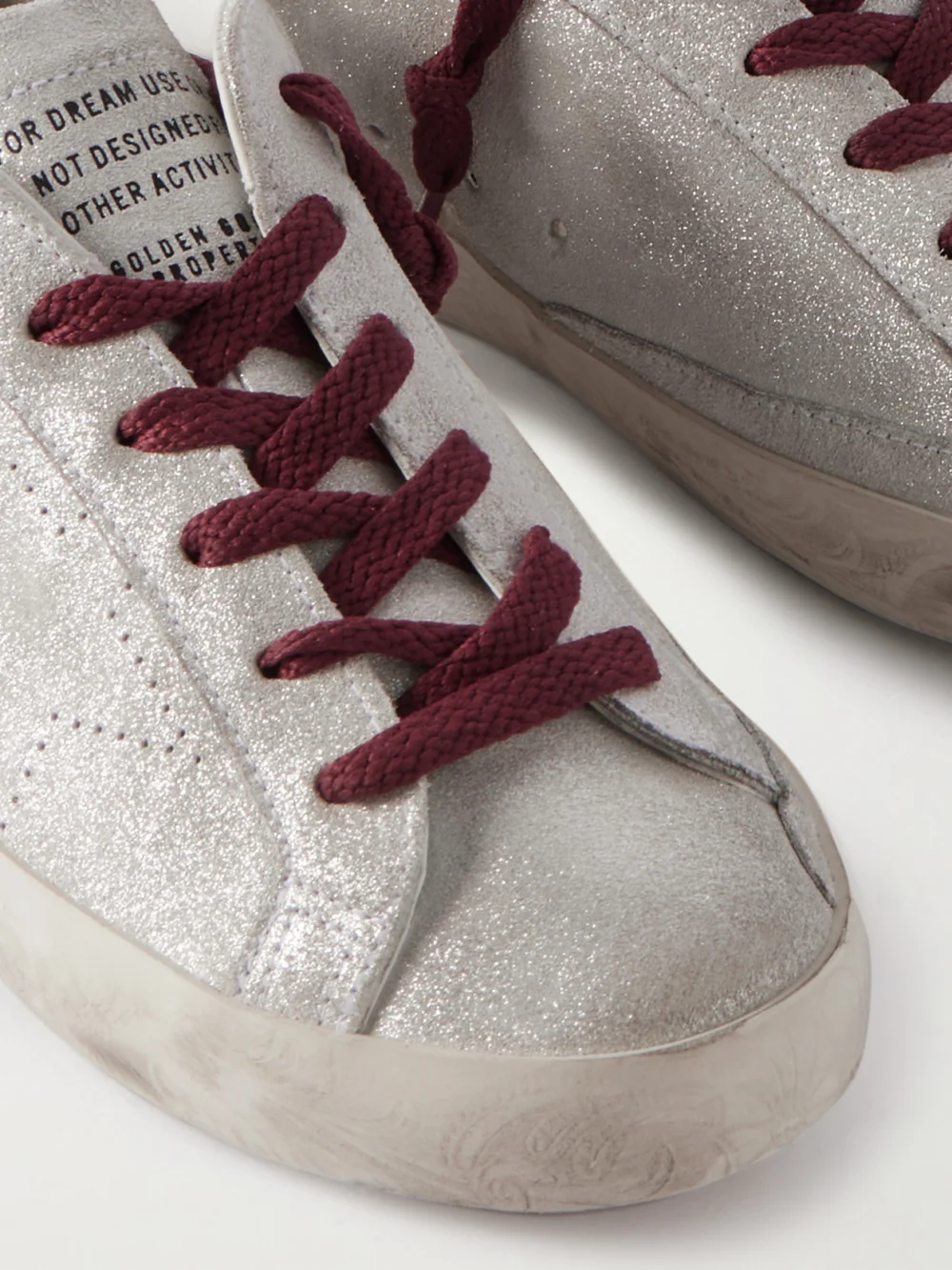 Close-up detail of the Golden Goose Super-star Distressed Leather-trimmed Metallic Suede Sneakers