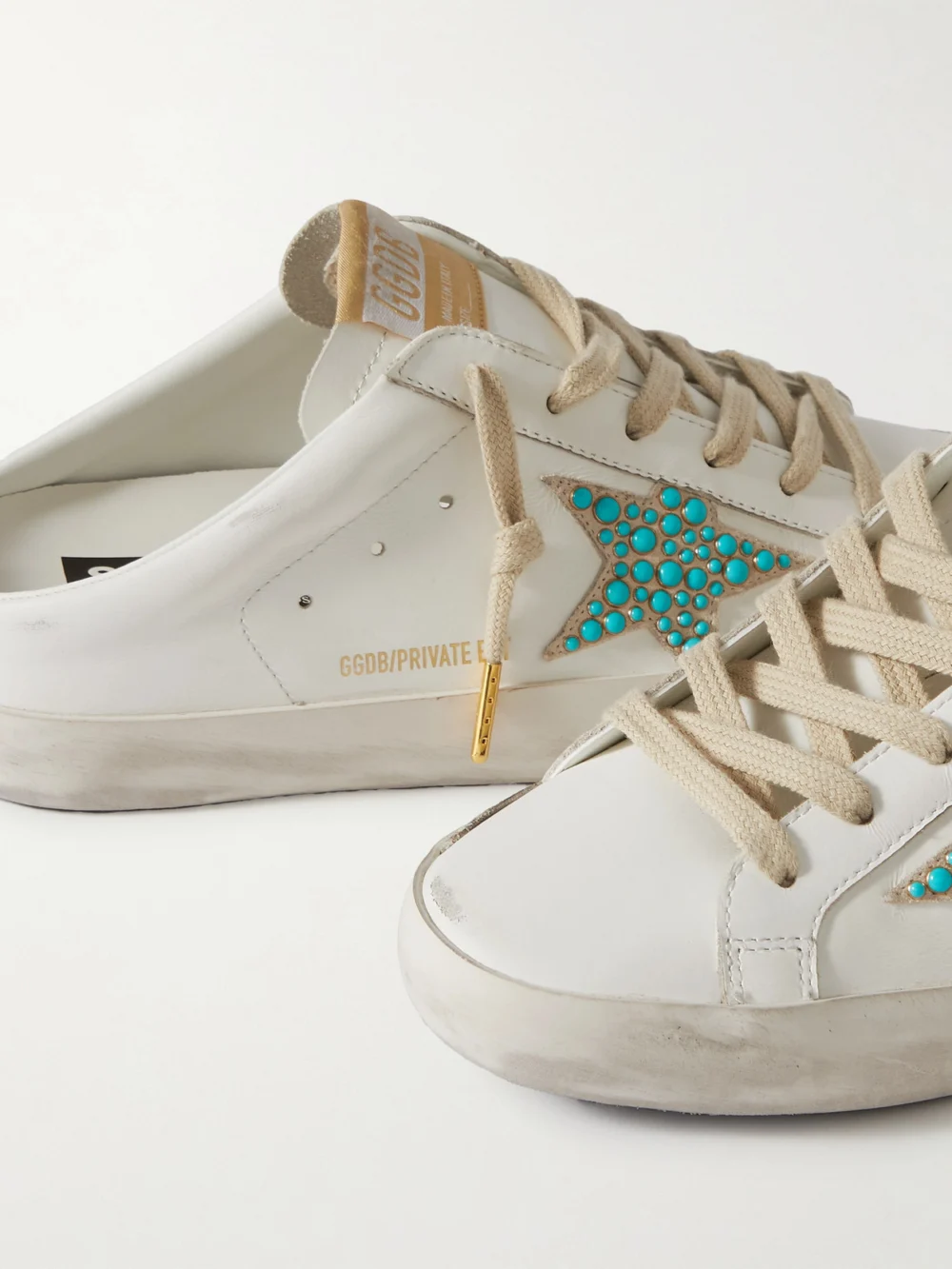 Close-up detail of the Golden Goose Super-star Sabot Distressed Embellished Leather Slip-on Sneakers