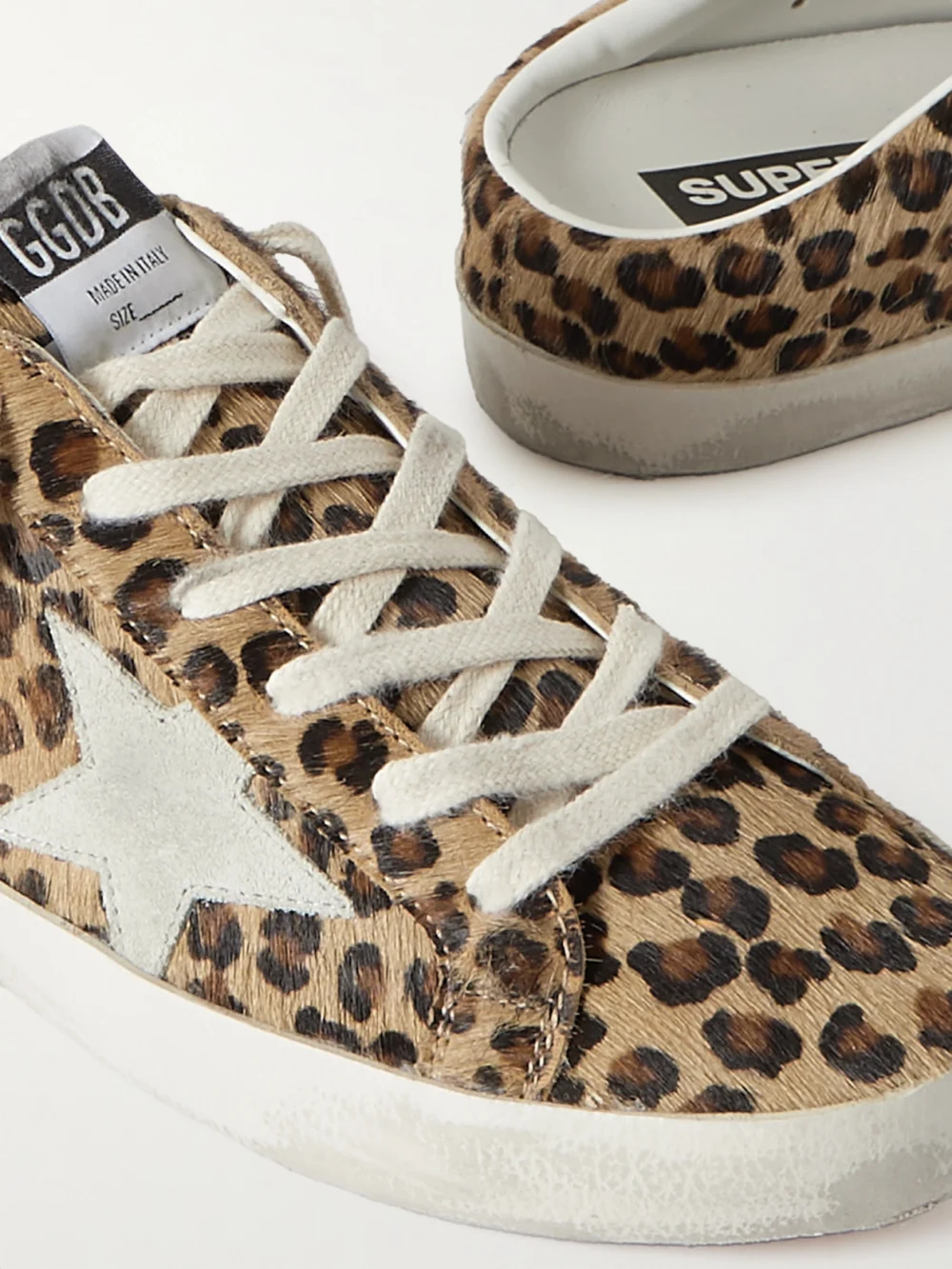 Close-up detail of the Golden Goose Super-star Sabot Distressed Leopard-print Calf Hair Slip-on Sneakers