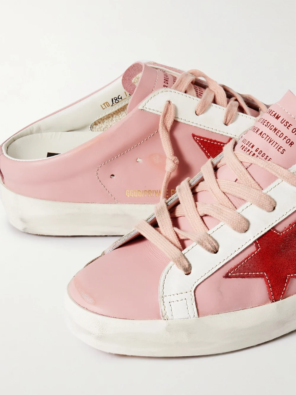 Close-up detail of the Golden Goose Super-star Sabot Distressed Suede-trimmed Leather Slip-on Sneakers