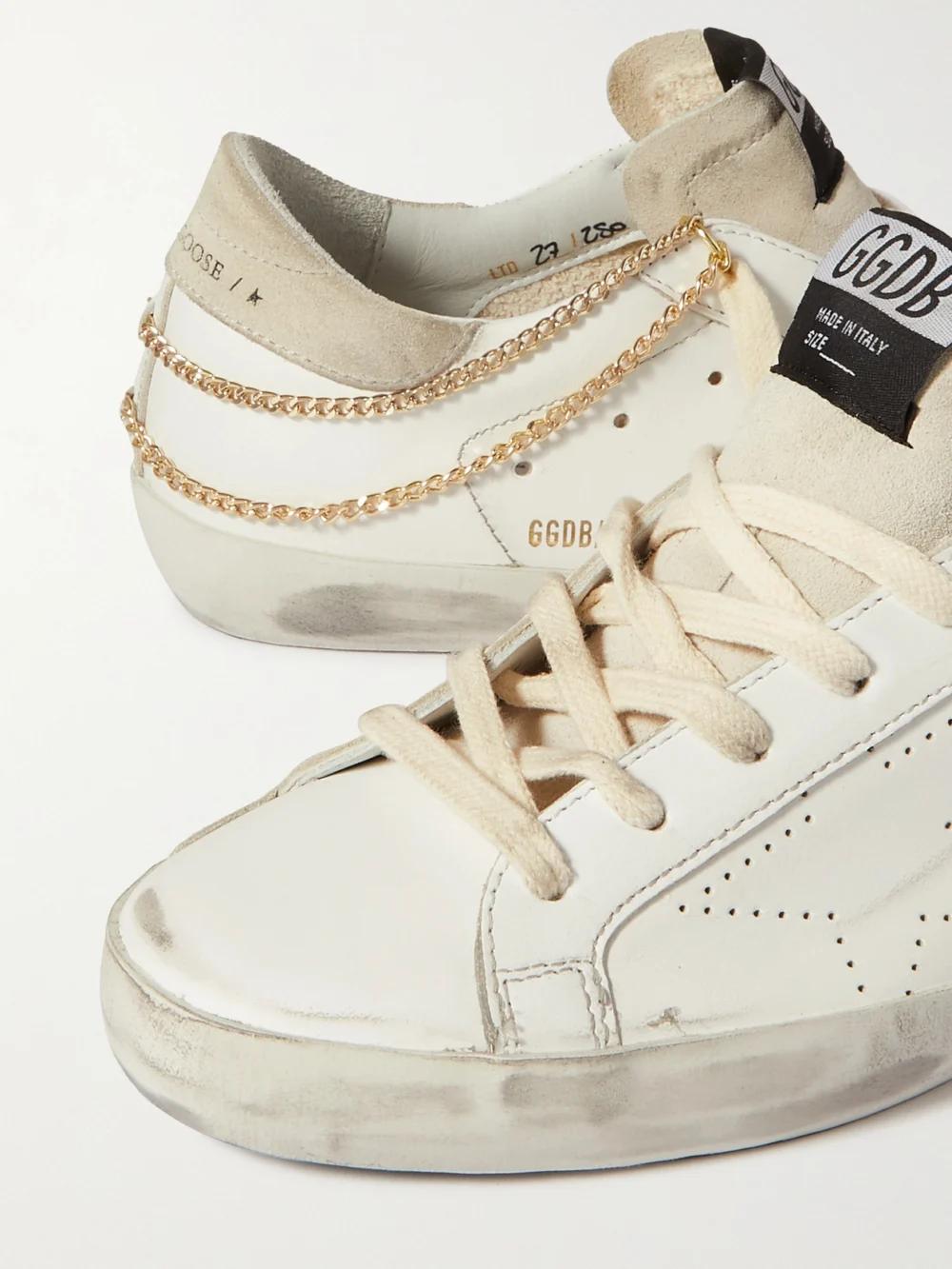 Close-up detail of the Golden Goose Superstar Chain-embellished Distressed Leather and Suede Sneakers