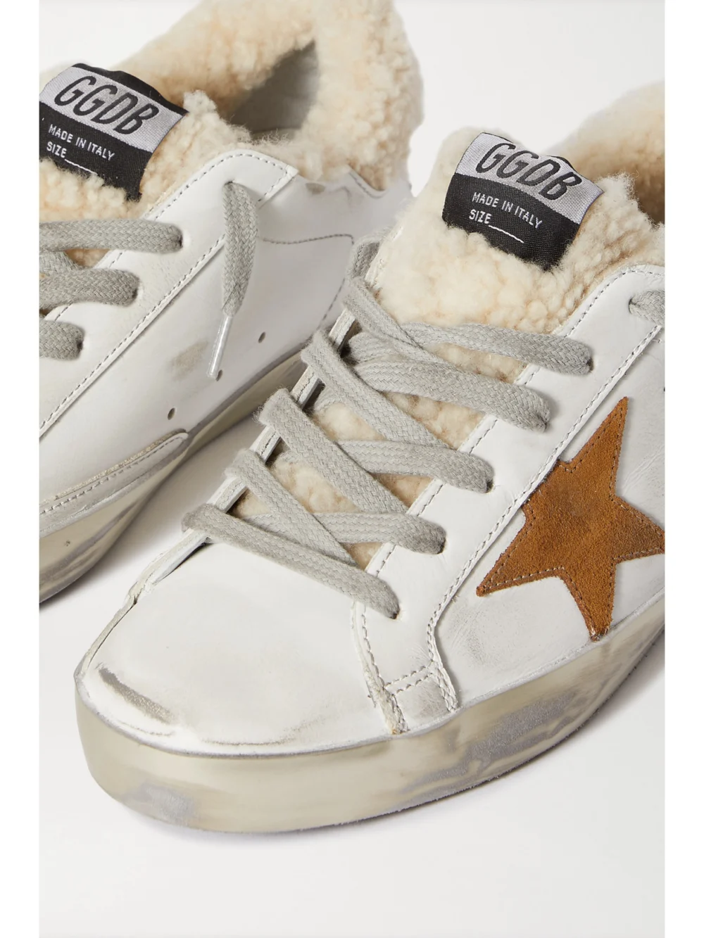 Close-up detail of the Golden Goose Superstar Distressed Leather, Suede and Shearling Sneakers