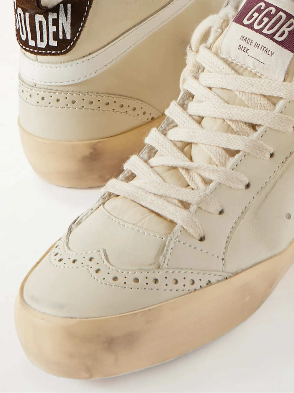 Close-up detail of the Golden Goose Superstar Distressed Shearling-lined Rubber and Leather Sneakers