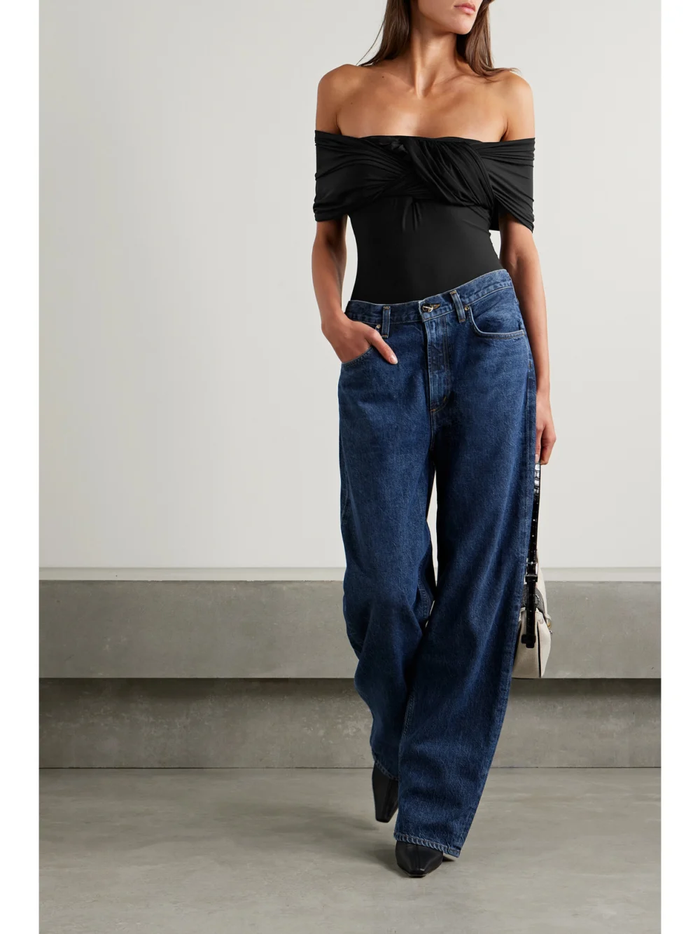 Goldsign The Odette Off-the-shoulder Twist-front Ruched Stretch-jersey Thong Bodysuit, worn by a model