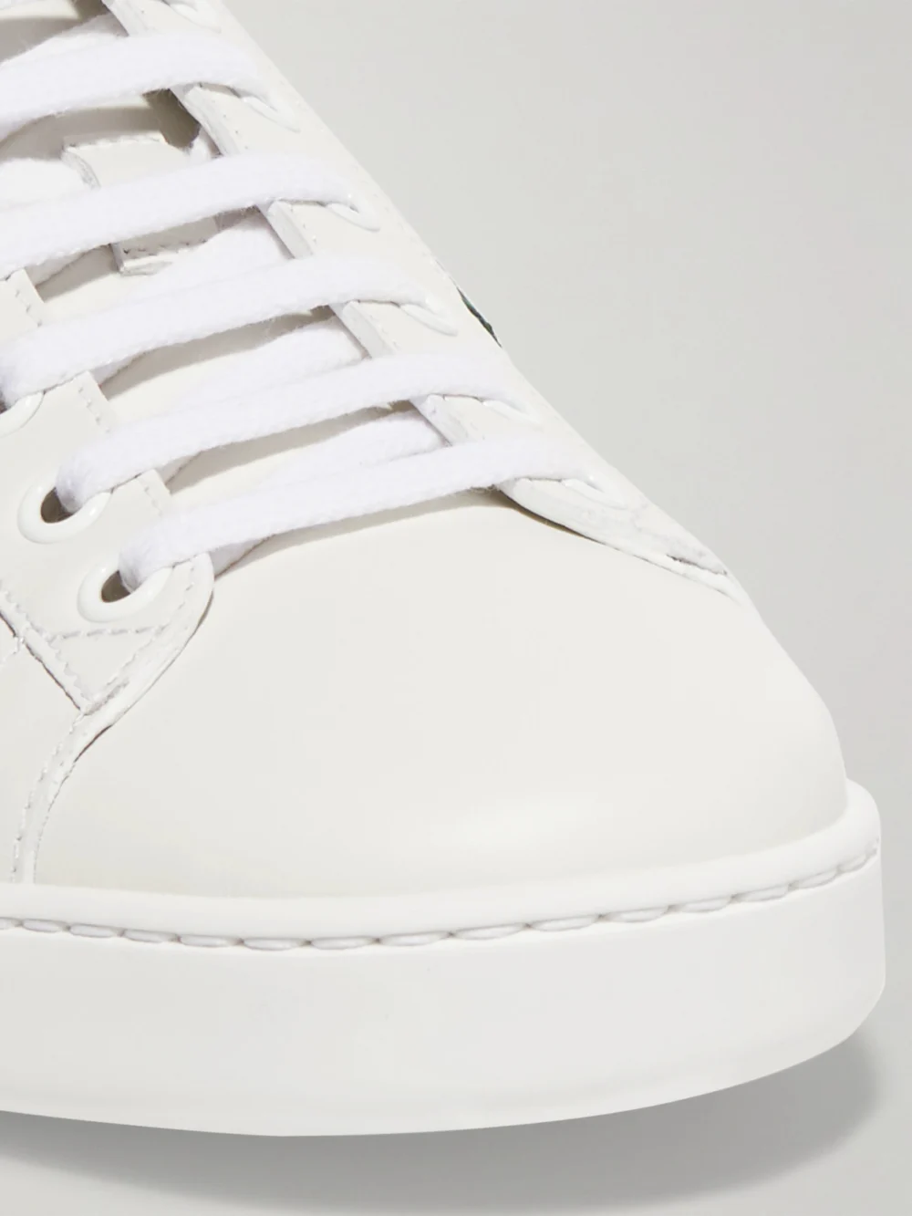 Close-up detail of the Gucci Ace Watersnake-trimmed Embroidered Leather Sneakers