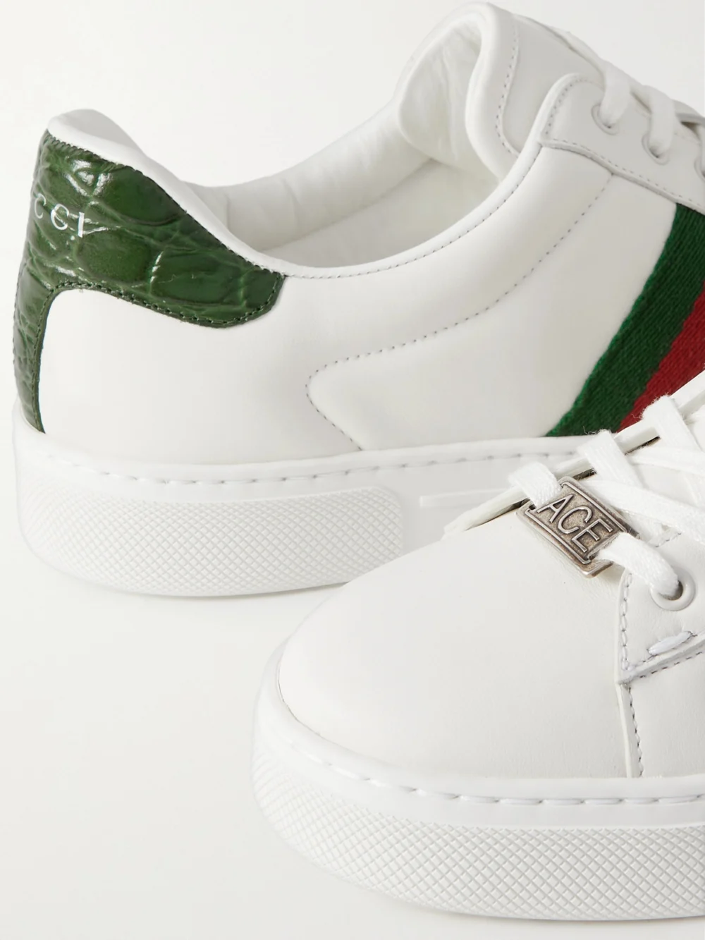 Close-up detail of the Gucci Ace Webbing-trimmed Leather Sneakers