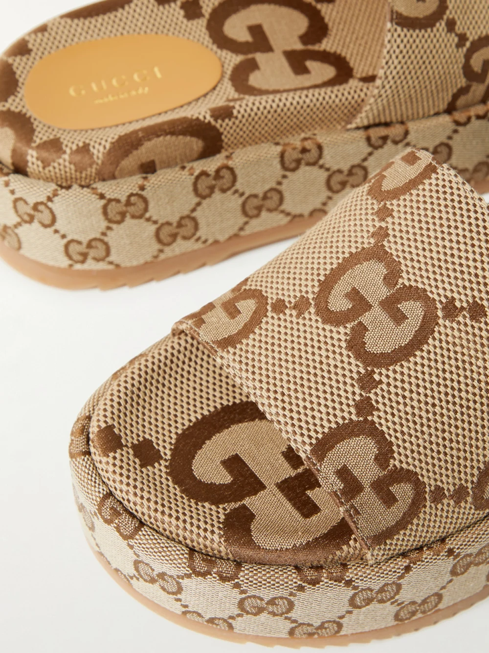 Close-up detail of the Gucci Angelina Logo-jacquard Coated-canvas Platform Slides