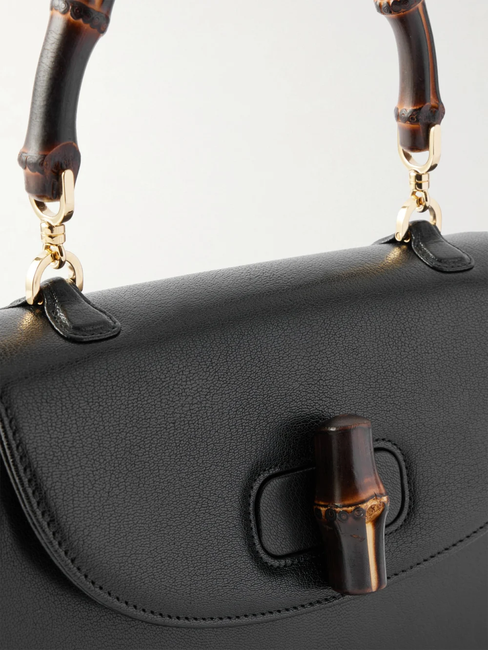 Close-up detail of the Gucci Bamboo 1947 Medium Leather Top-handle Bag