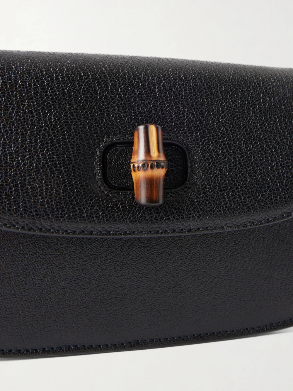 Close-up detail of the Gucci Bamboo 1947 Textured-leather Clutch