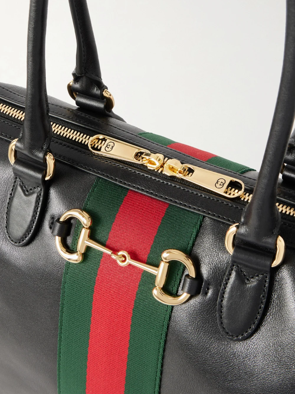Close-up detail of the Gucci Borsetto Large Webbing-trimmed Textured-leather Shoulder Bag