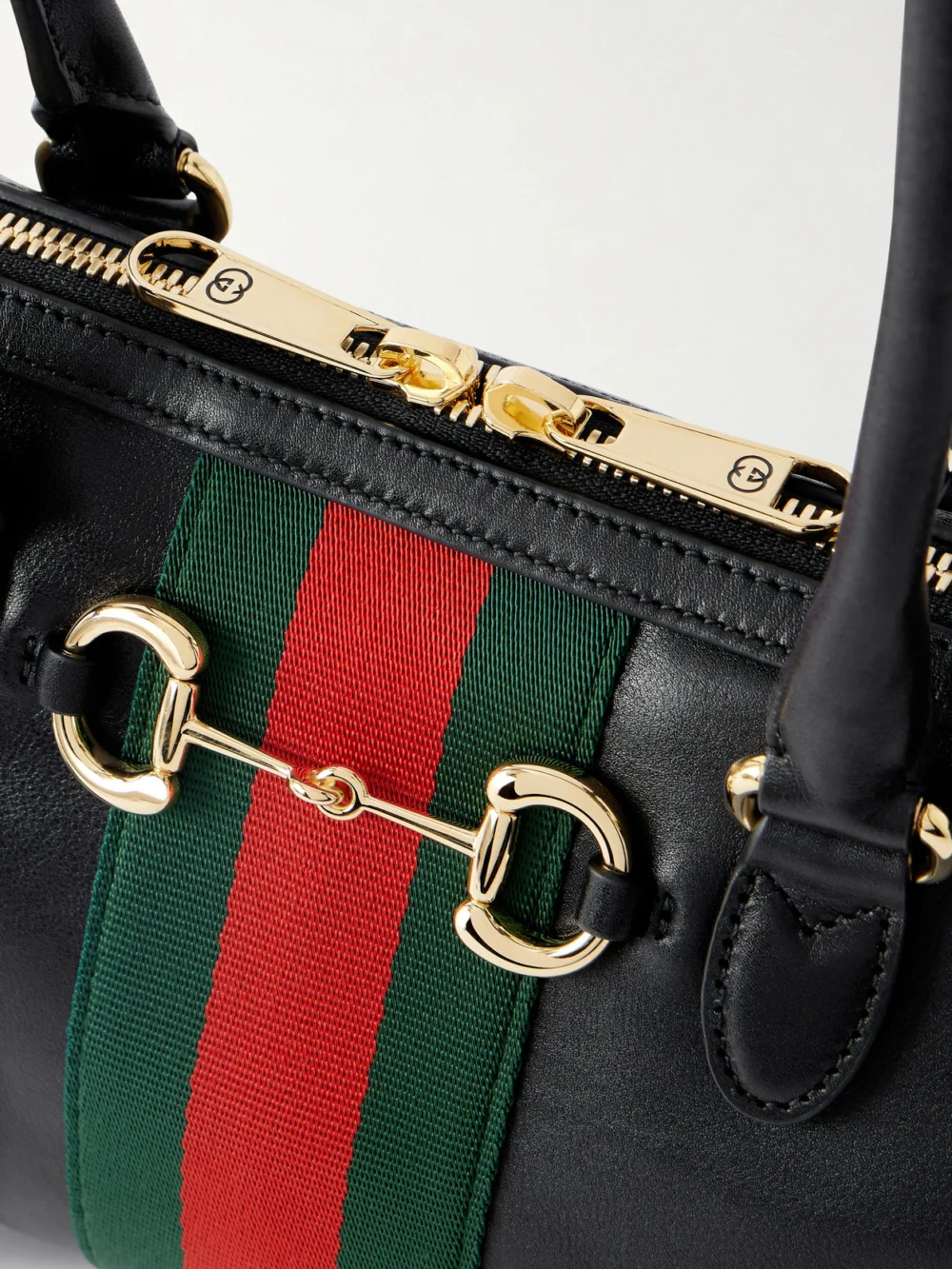 Close-up detail of the Gucci Borsetto Small Webbing-trimmed Leather Shoulder Bag