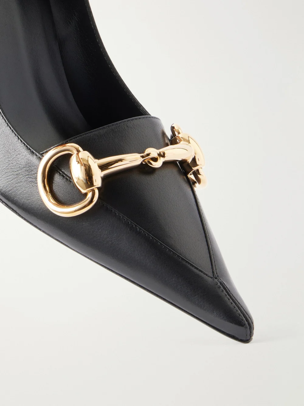Close-up detail of the Gucci Boulevard Horsebit-embellished Leather Pumps