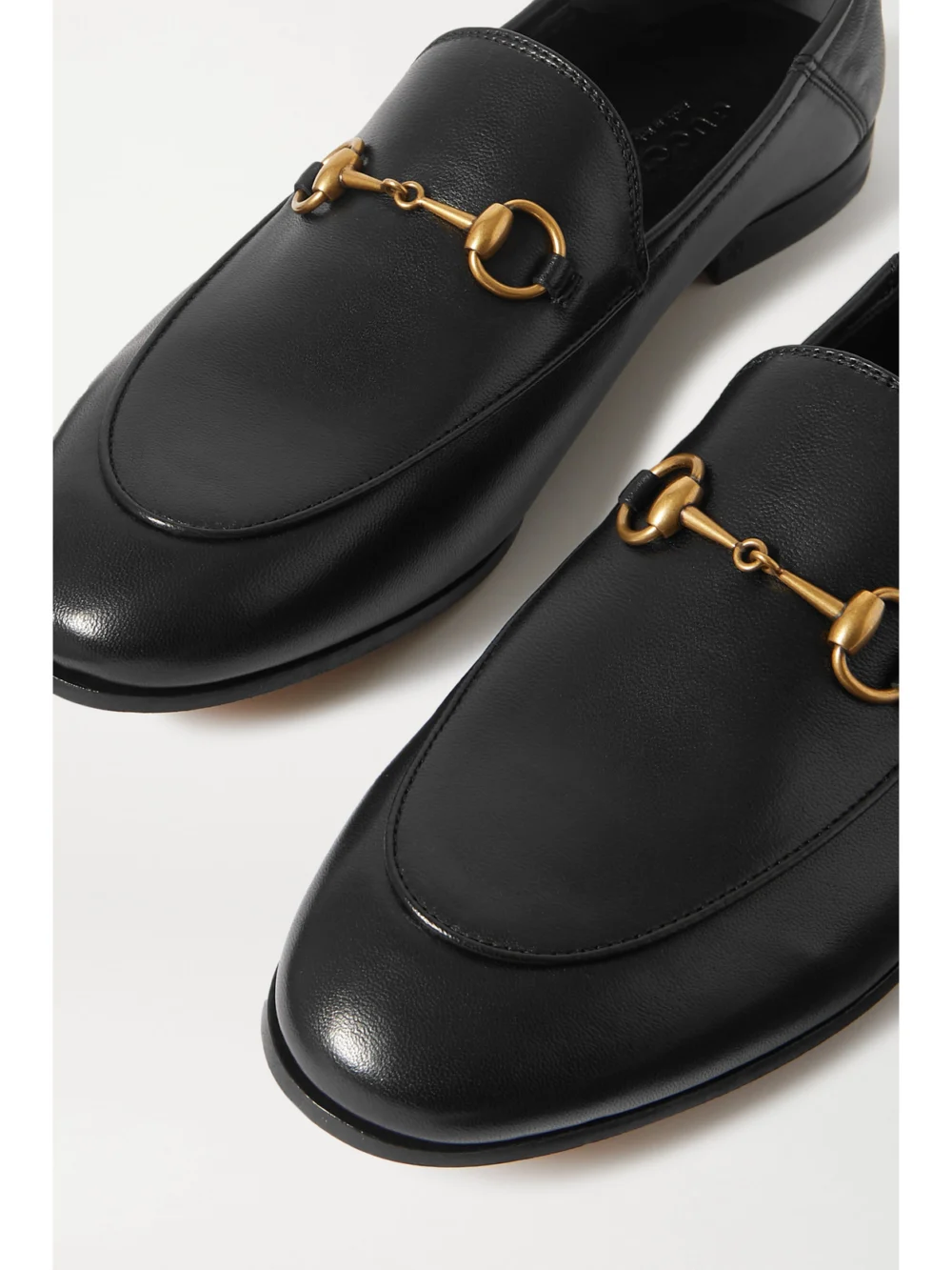 Close-up detail of the Gucci Brixton Horsebit-detailed Leather Collapsible-heel Loafers
