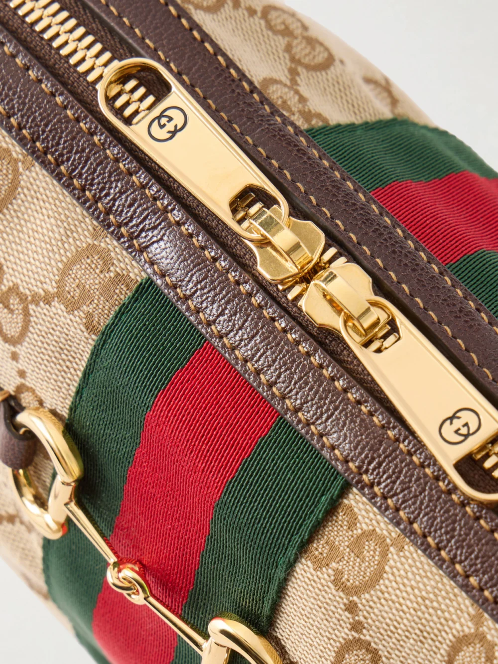 Close-up detail of the Gucci Camera Case Web-trimmed Canvas Shoulder Bag