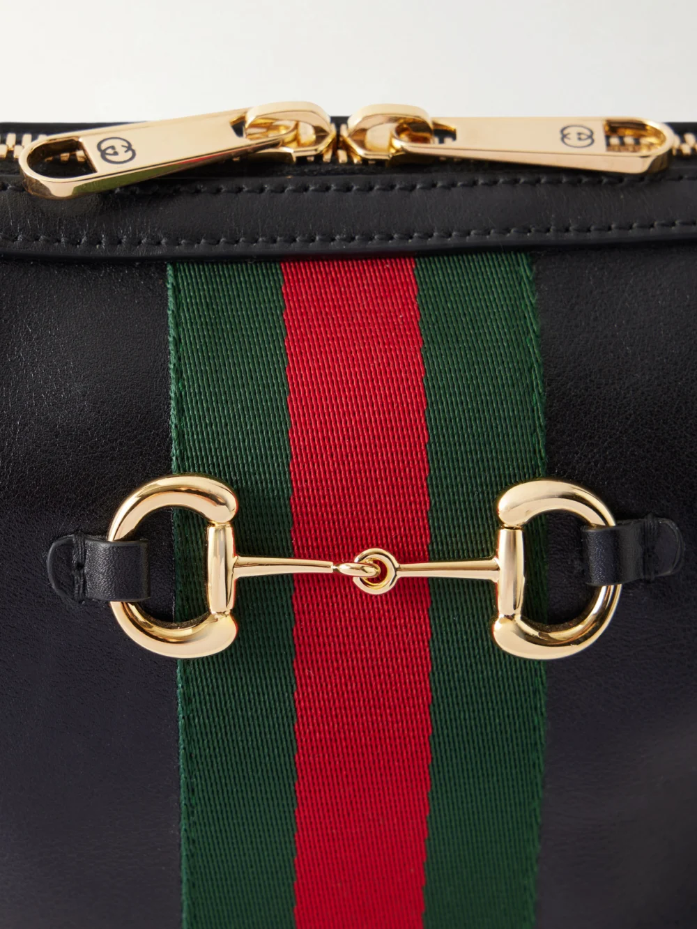 Close-up detail of the Gucci Camera Case Web-trimmed Leather Shoulder Bag