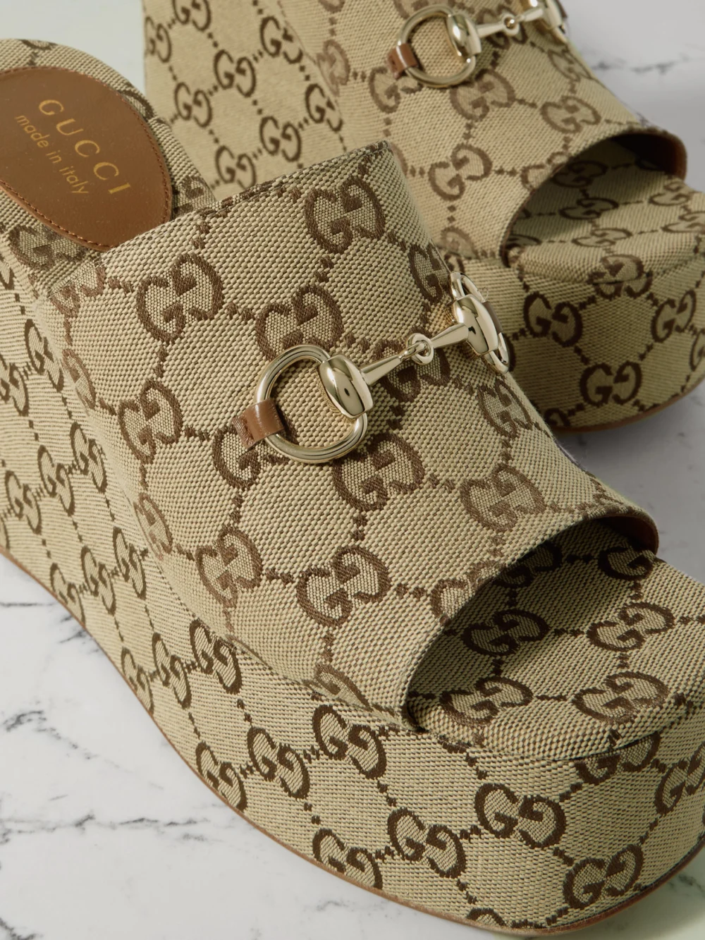 Close-up detail of the Gucci Carmen Horsebit-embellished Canvas-jacquard Wedge Mules