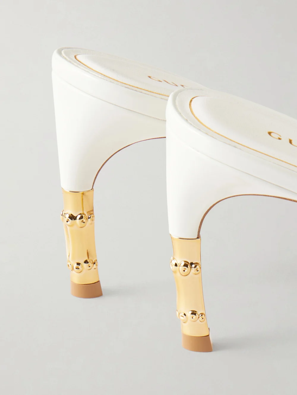 Close-up detail of the Gucci Castello Patent-leather Sandals