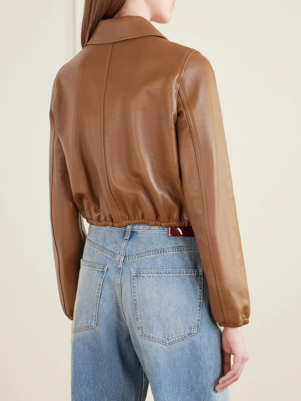 Back view of the Gucci Cropped Embossed Leather Bomber Jacket