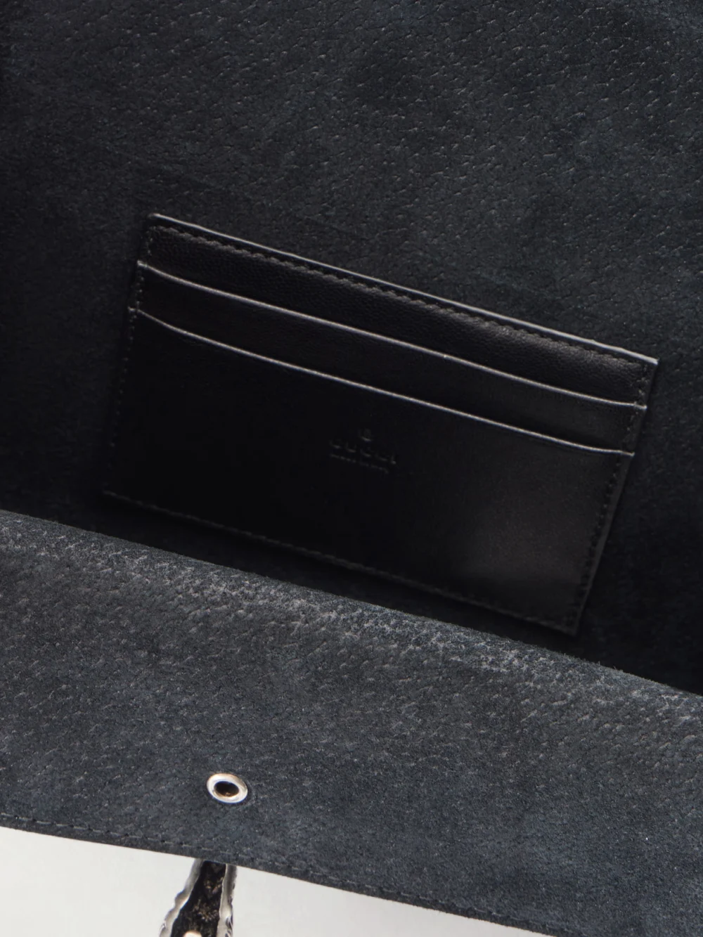 Close-up detail of the Gucci Dionysus Leather-trimmed Coated Canvas-jacquard Shoulder Bag