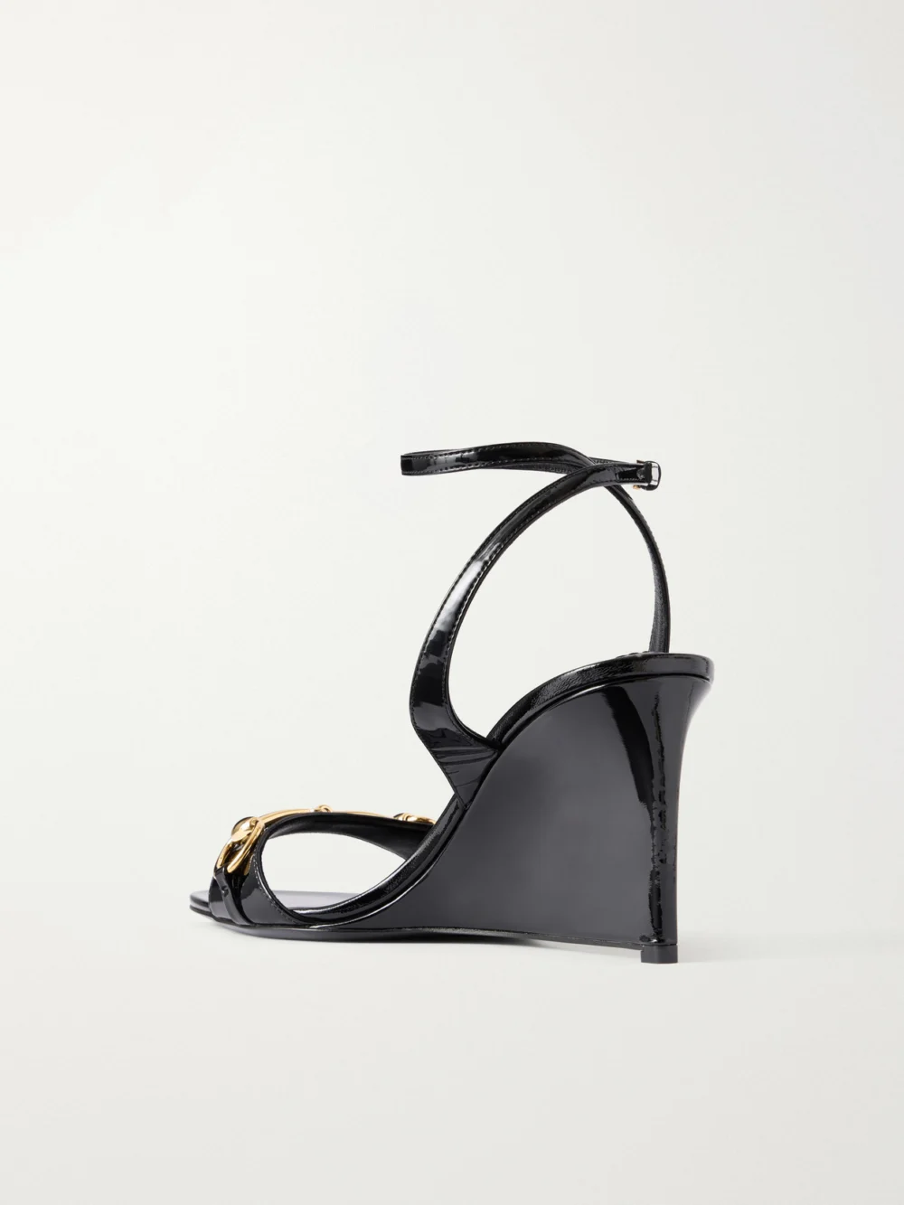 Back view of the Gucci Donna 80 Horsebit-embellished Patent-leather Wedge Sandals