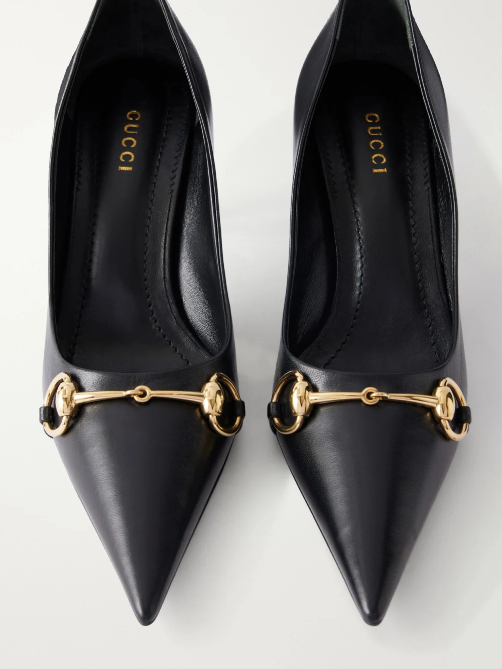 Close-up detail of the Gucci Donna Embellished Leather Pumps