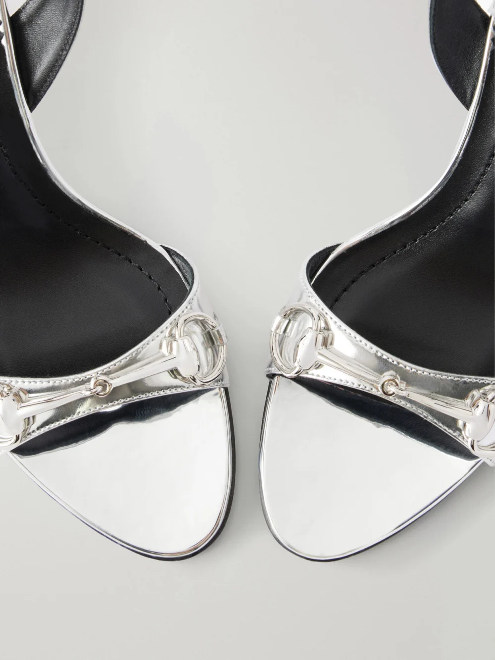 Close-up detail of the Gucci Donna Embellished Leather Wedge Sandals
