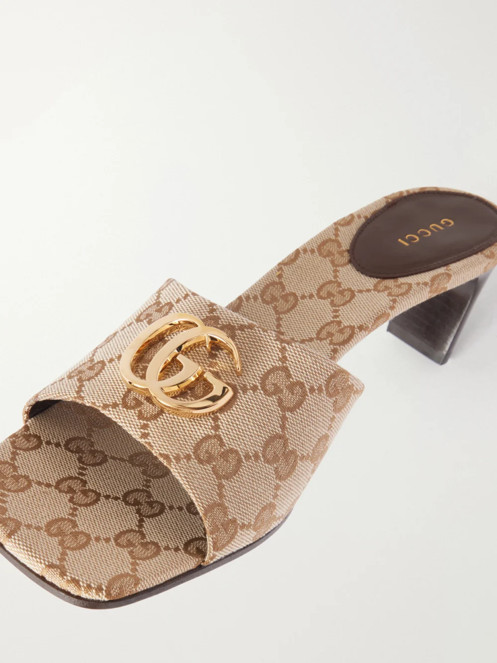 Close-up detail of the Gucci Double G-embellished Canvas-jacquard Mules