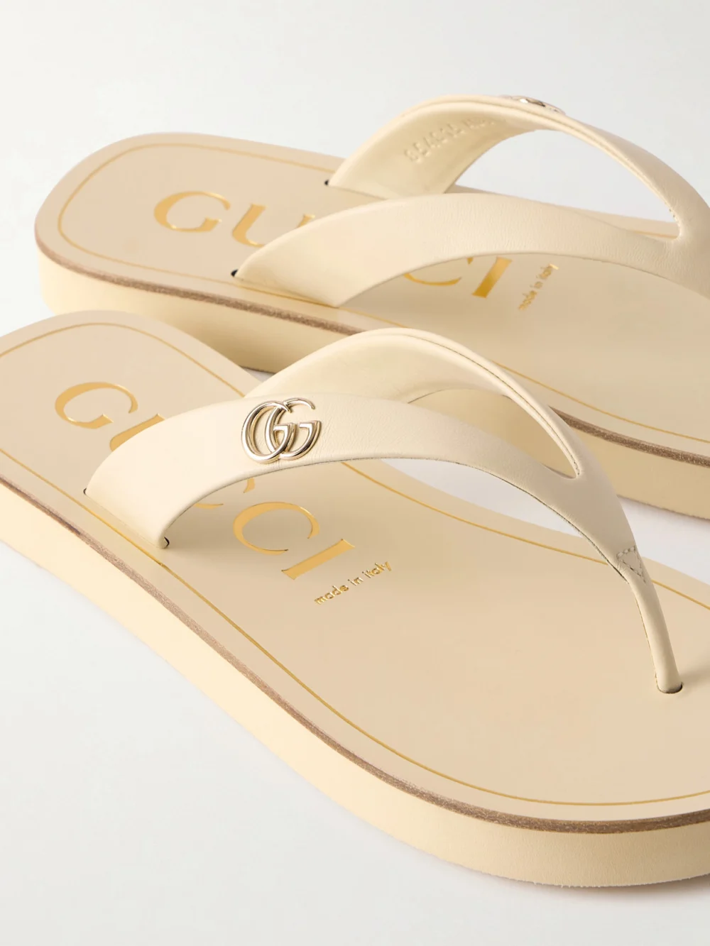 Close-up detail of the Gucci Embellished Leather Sandals