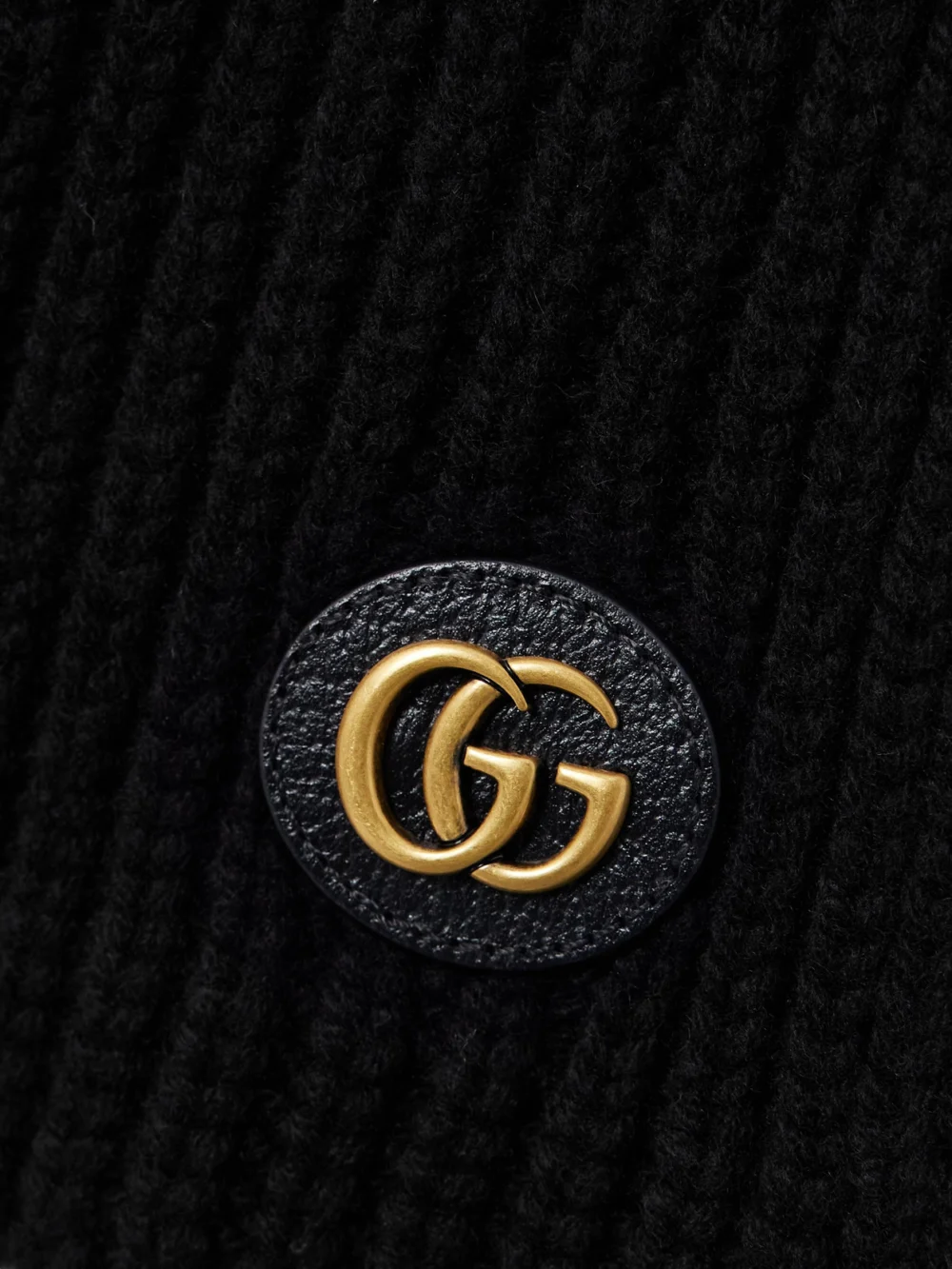 Close-up detail of the Gucci Embellished Leather-trimmed Ribbed Wool and Cashmere-blend Scarf