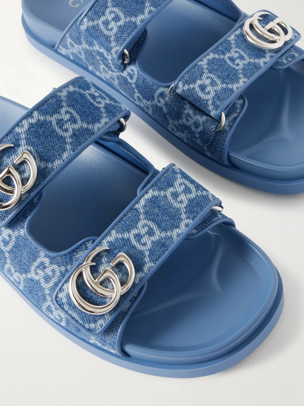 Close-up detail of the Gucci Embellished Printed Denim Sandals