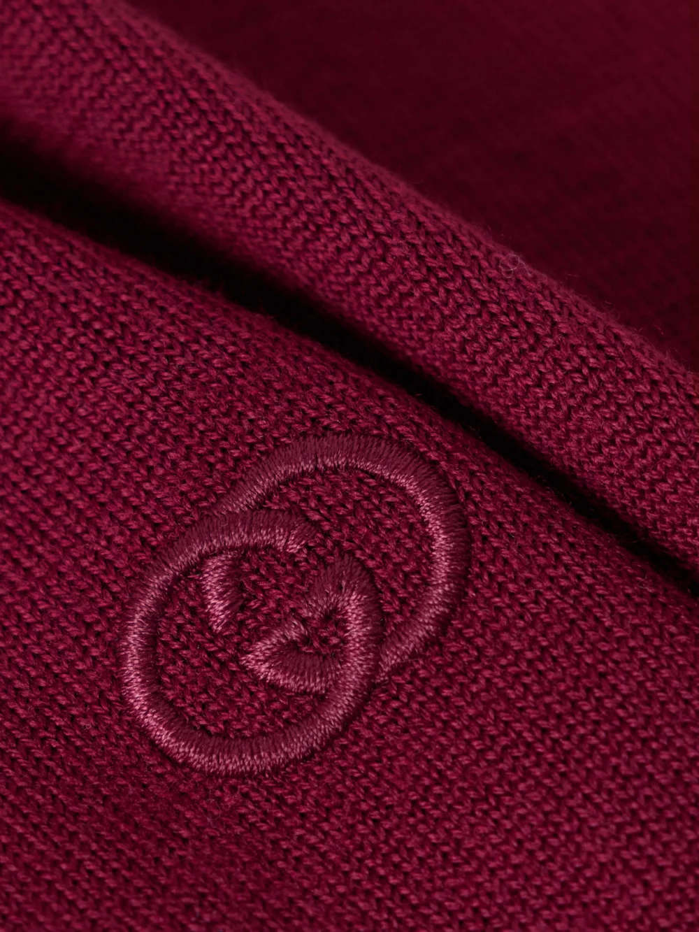 Close-up detail of the Gucci Embroidered Wool Polo Sweater