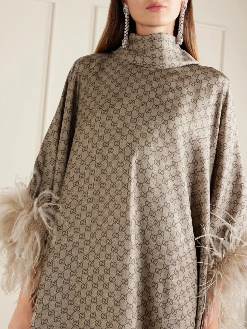 Close-up detail of the Gucci Feather-trimmed Printed Satin Maxi Dress
