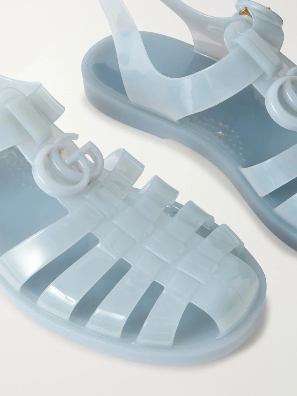 Close-up detail of the Gucci Fisherman Embellished Rubber Sandals