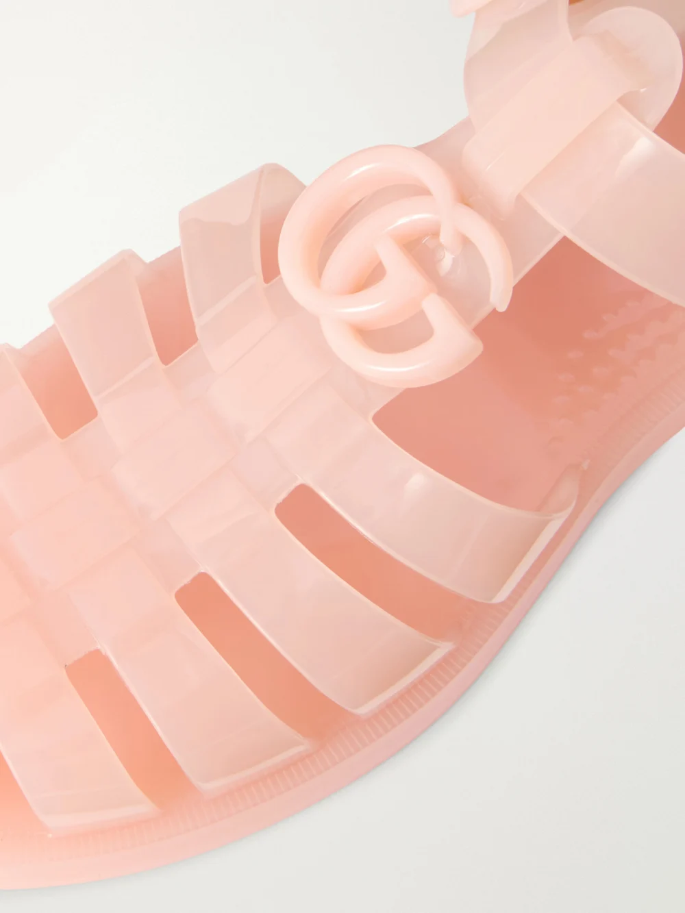 Close-up detail of the Gucci Fisherman Embellished Rubber Sandals