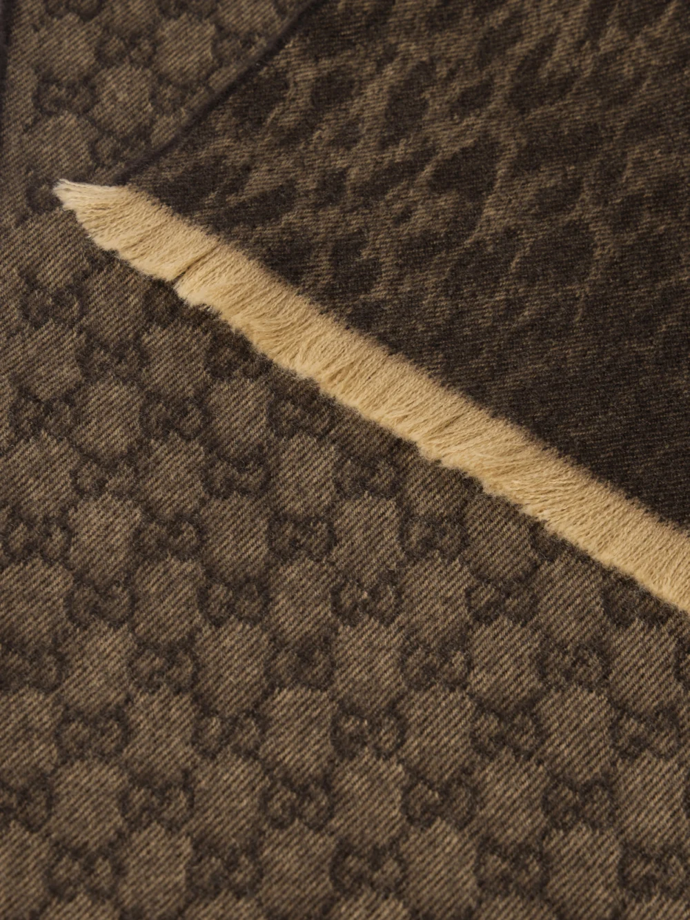 Close-up detail of the Gucci Frayed Logo and Leopard-jacquard Wool Scarf