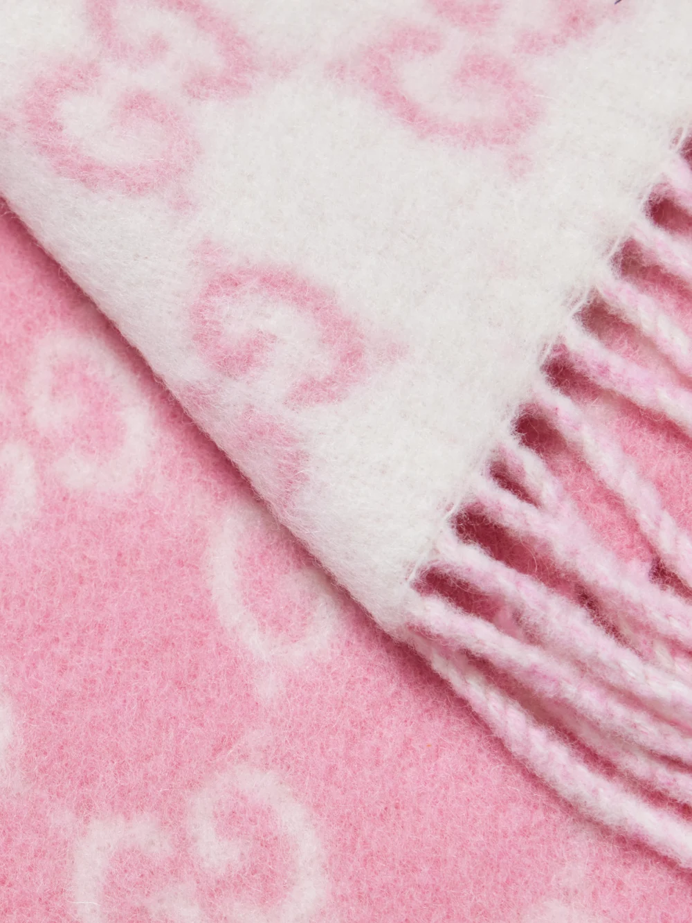 Close-up detail of the Gucci Fringed Jacquard-knit Scarf