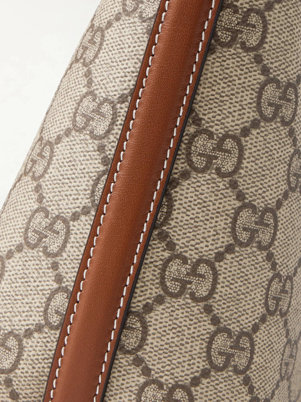 Close-up detail of the Gucci Gg Emblem Mini Leather-trimmed Coated Canvas-jacquard Shoulder Bag