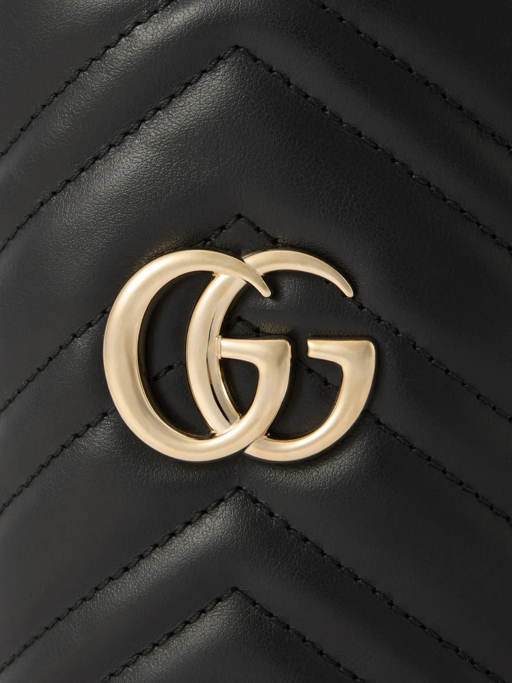 Close-up detail of the Gucci Gg Marmont Mini Matelassé Leather Bucket Bag