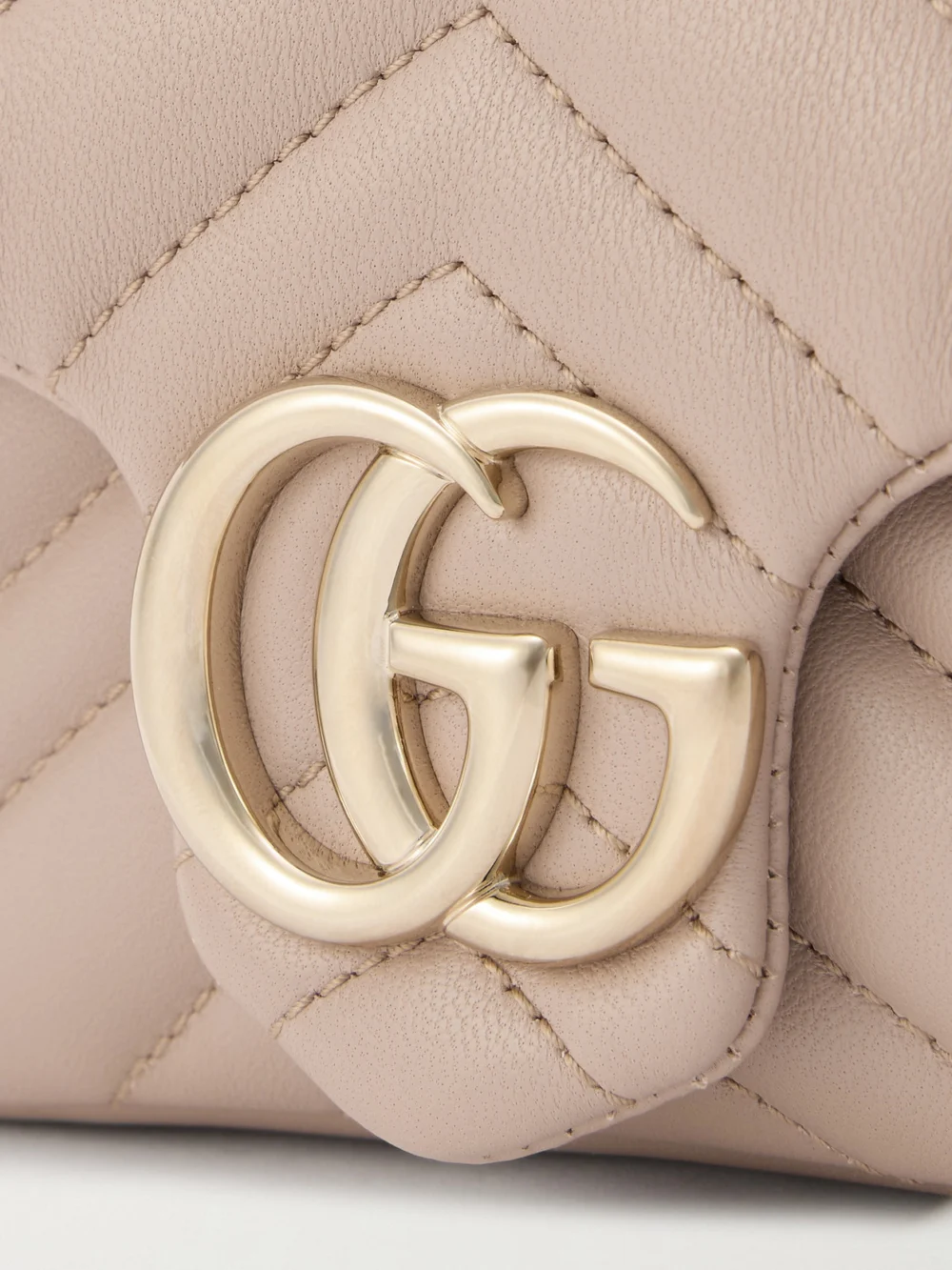 Close-up detail of the Gucci Gg Marmont Mini Matelassé Leather Shoulder Bag