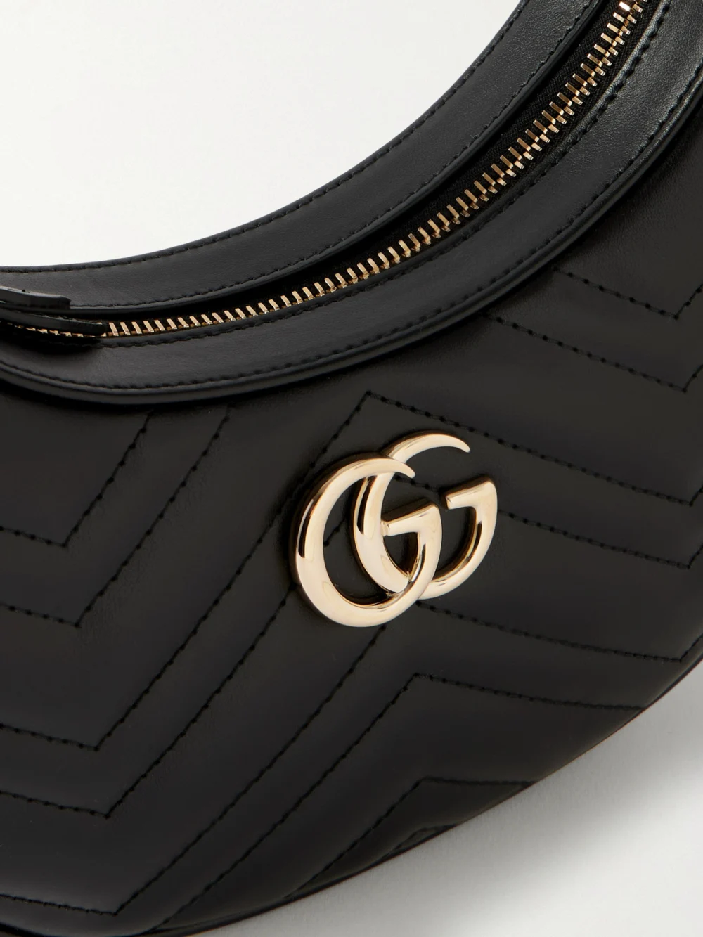 Close-up detail of the Gucci Gg Marmont Mini Matelassé Leather Shoulder Bag