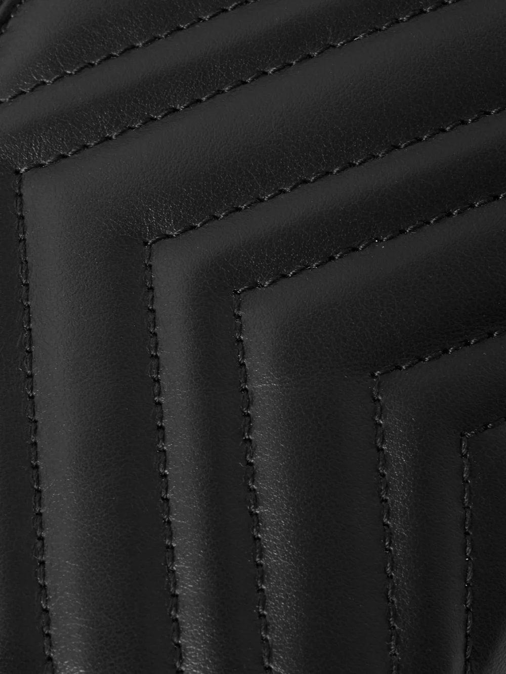 Close-up detail of the Gucci Gg Marmont Mini Matelassé Leather Shoulder Bag