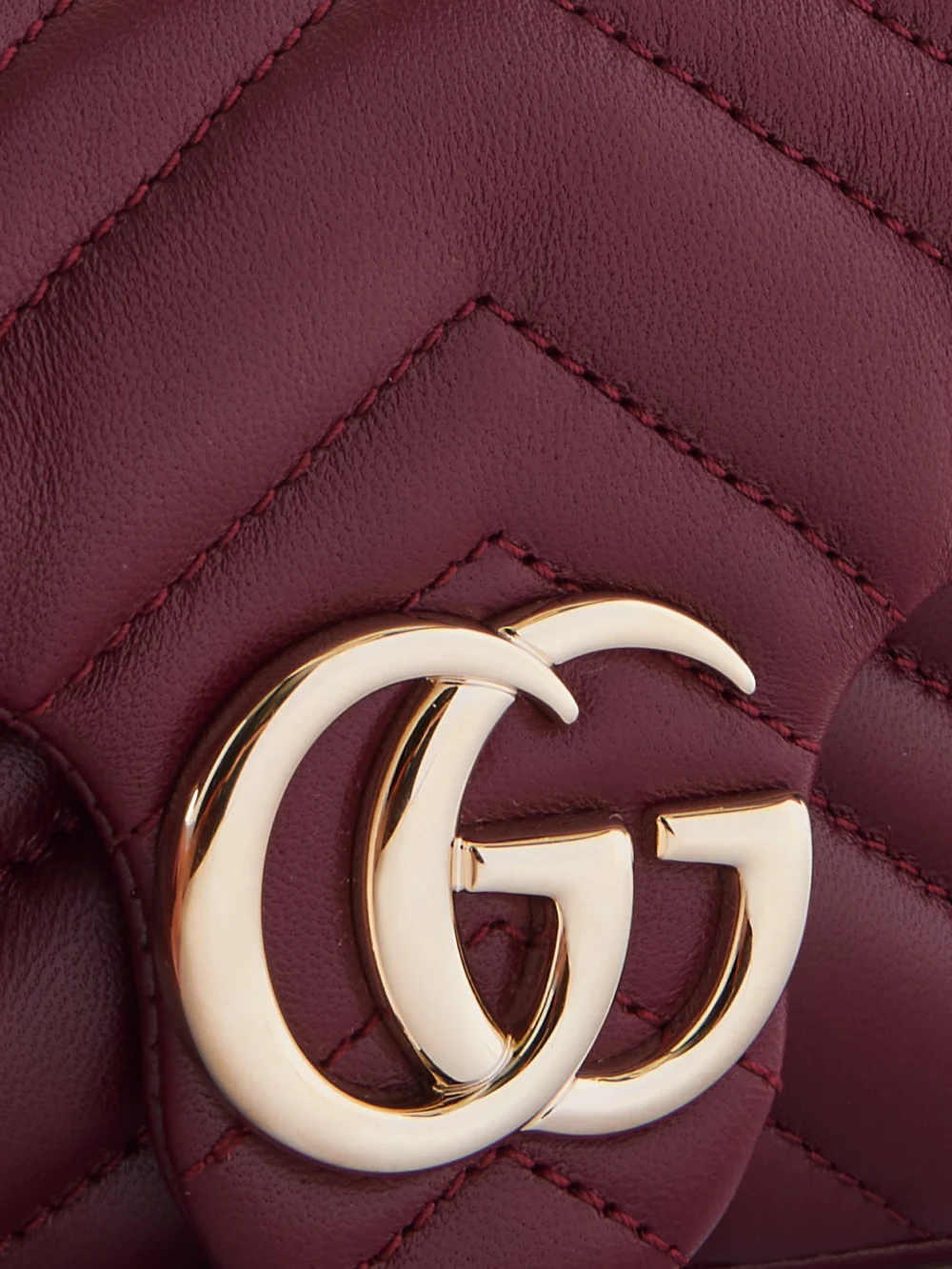 Close-up detail of the Gucci Gg Marmont Mini Matelassé Leather Shoulder Bag